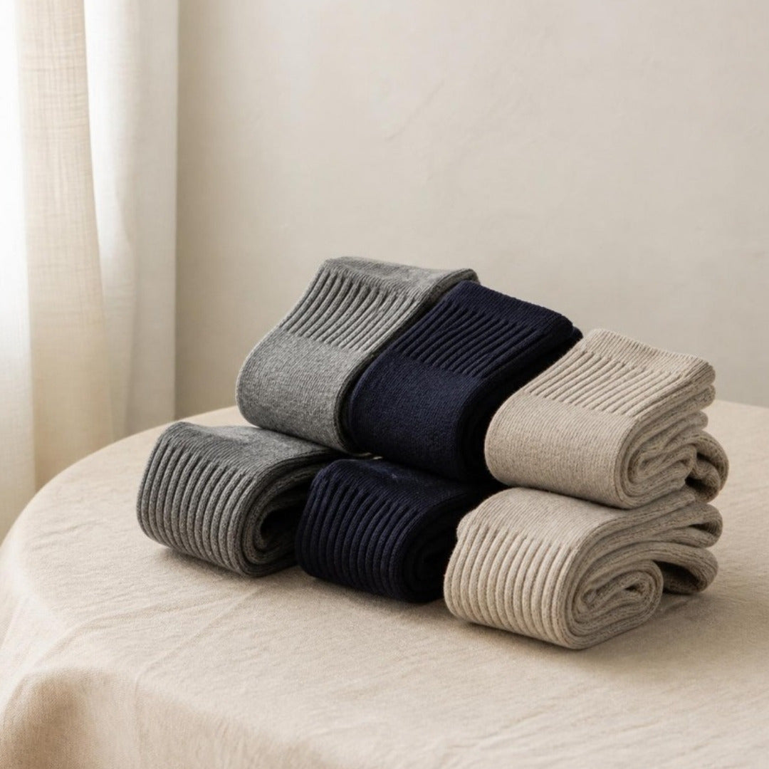 Rolled men's crew socks in grey, navy and oatmeal