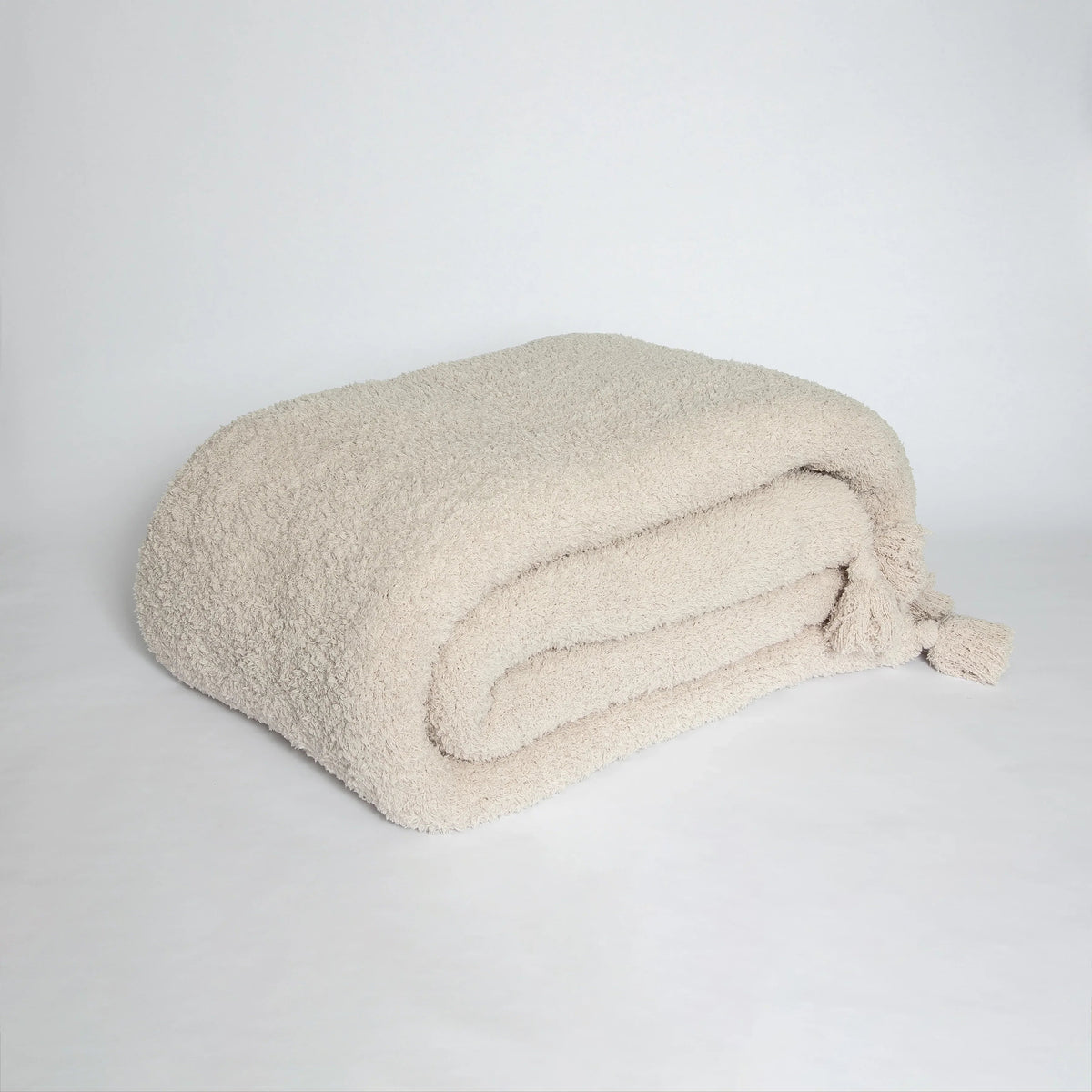 Sunset Snuggles Blushing Beige Solid Tassel Throw, 54 x 76 in